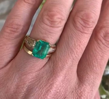 Emerald cut Emerald & diamond ring in 18ct gold