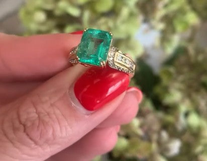 Emerald cut Emerald & diamond ring in 18ct gold