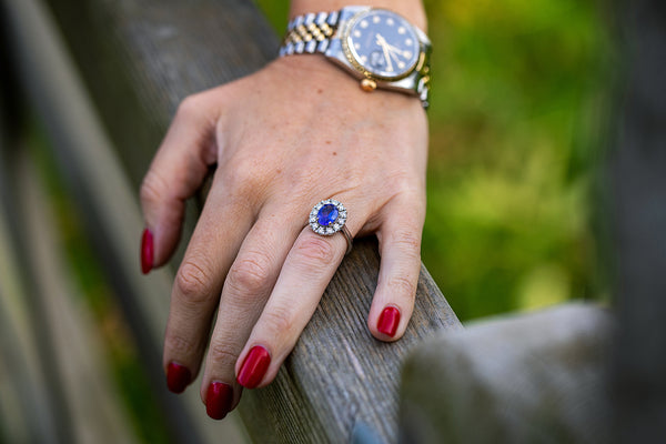 Oval shaped Tanzanite ring surrounded by approx 1ct of diamonds set in 18ct white gold